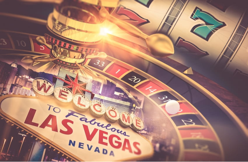 a roulette table styled over the "welcome to fabulous las vegas" sign